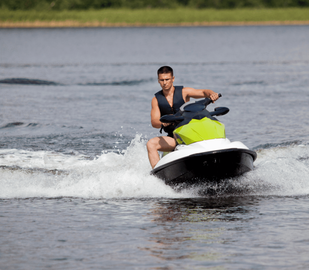 Man Riding A Jet Ski Across The Water