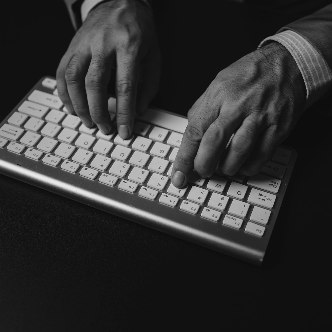 Hands Typing On A Computer Keyboard
