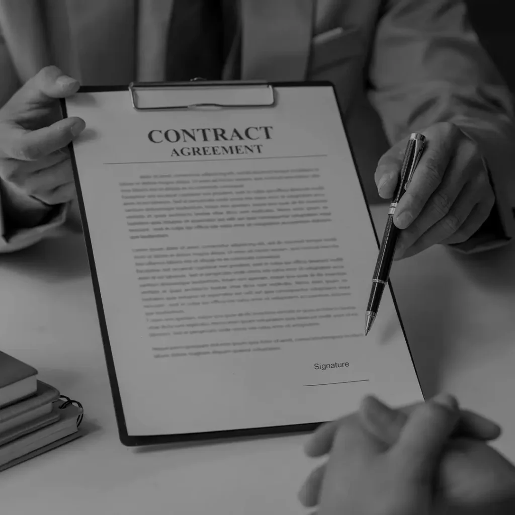 Close-Up Of Hands Signing A Contract