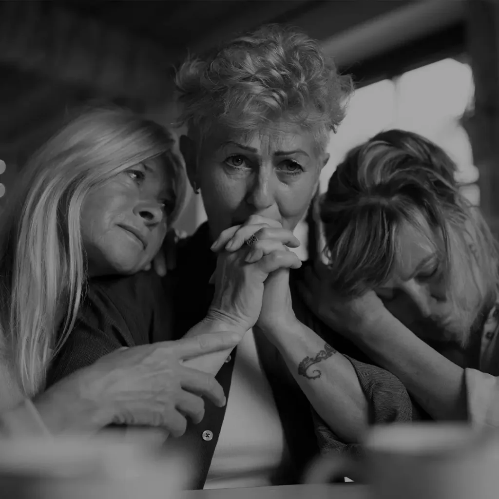 Three Generations Of Women Embracing Each Other