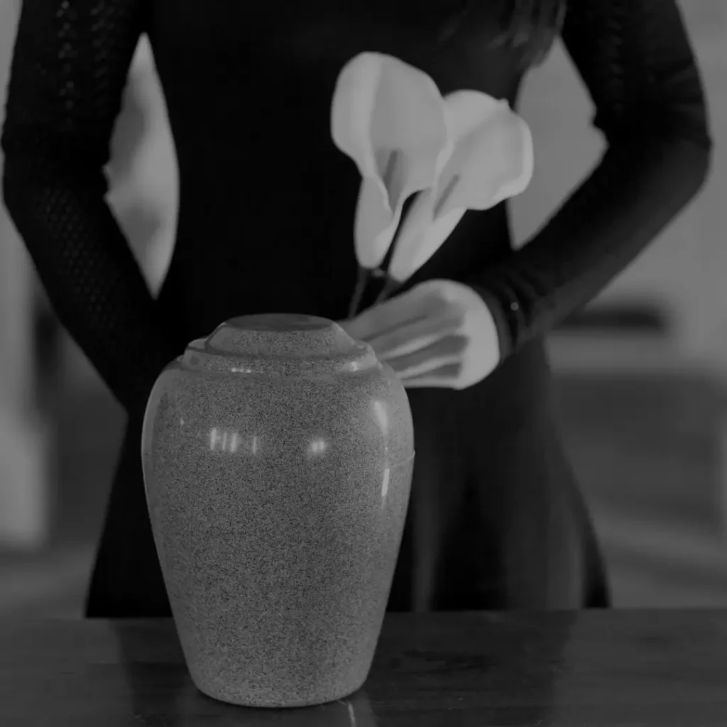 Hands Holding A Cremation Urn