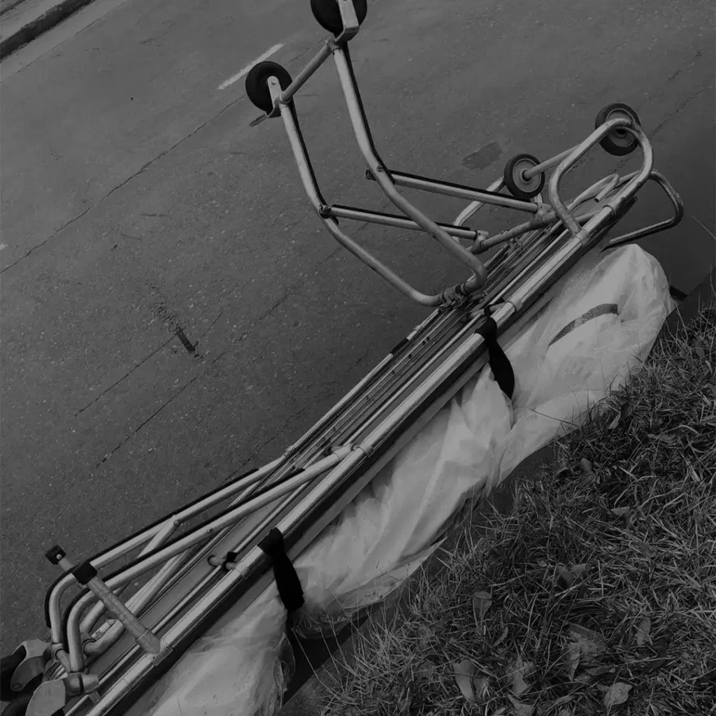 Body Wrapped And Tied On A Stretcher Outdoors