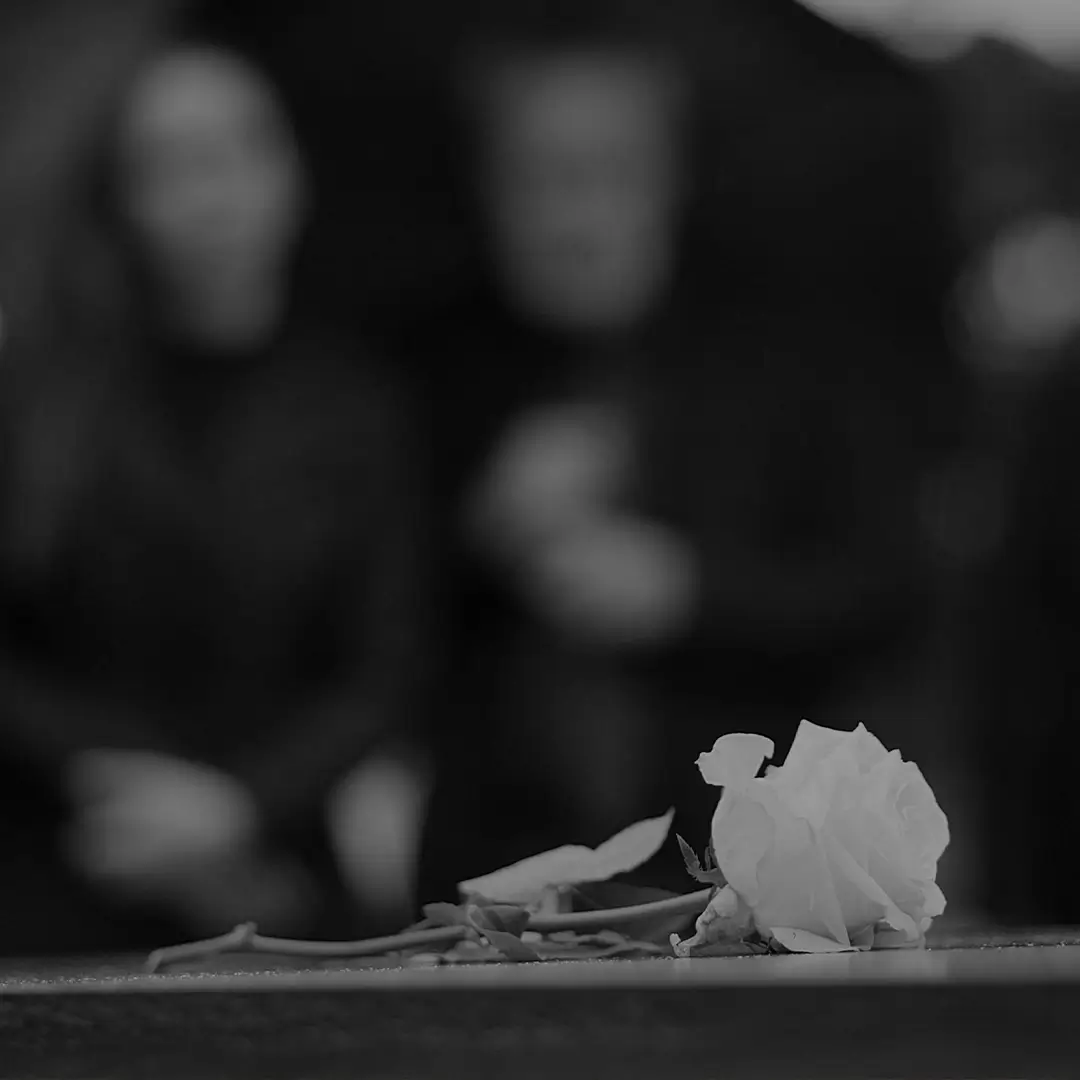 Blurred Black And White Photo Of A Cemetery Headstone